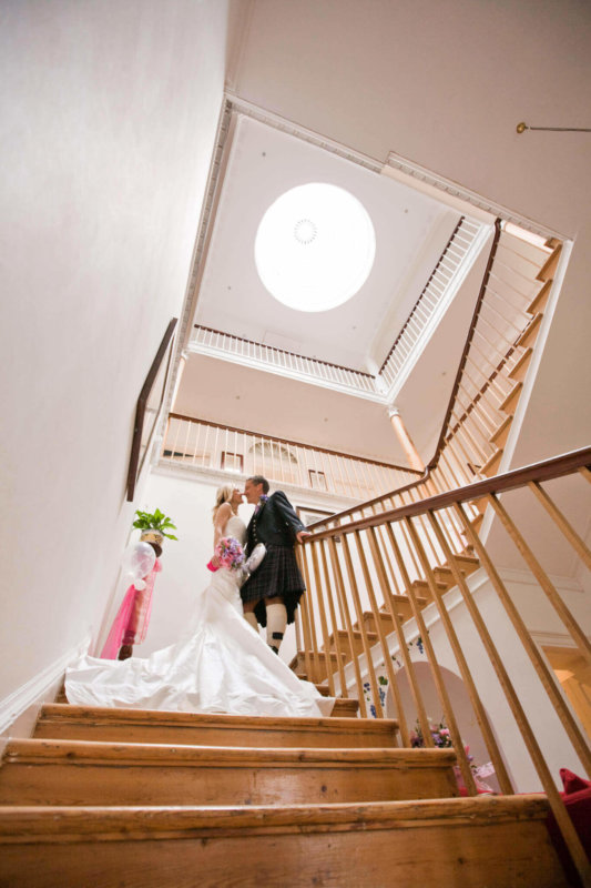 Bride and groom on the stairs