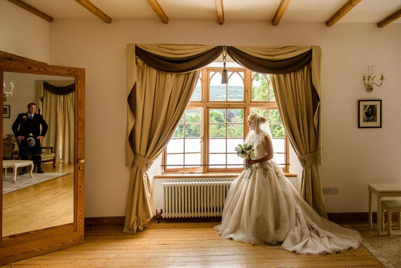 Bride sitting by the window